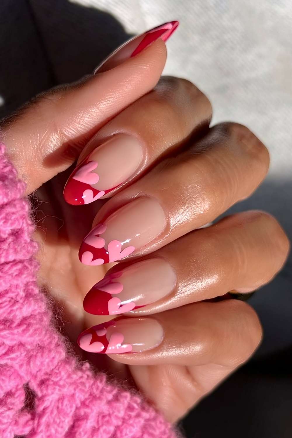Deep red French nails with pink heart art