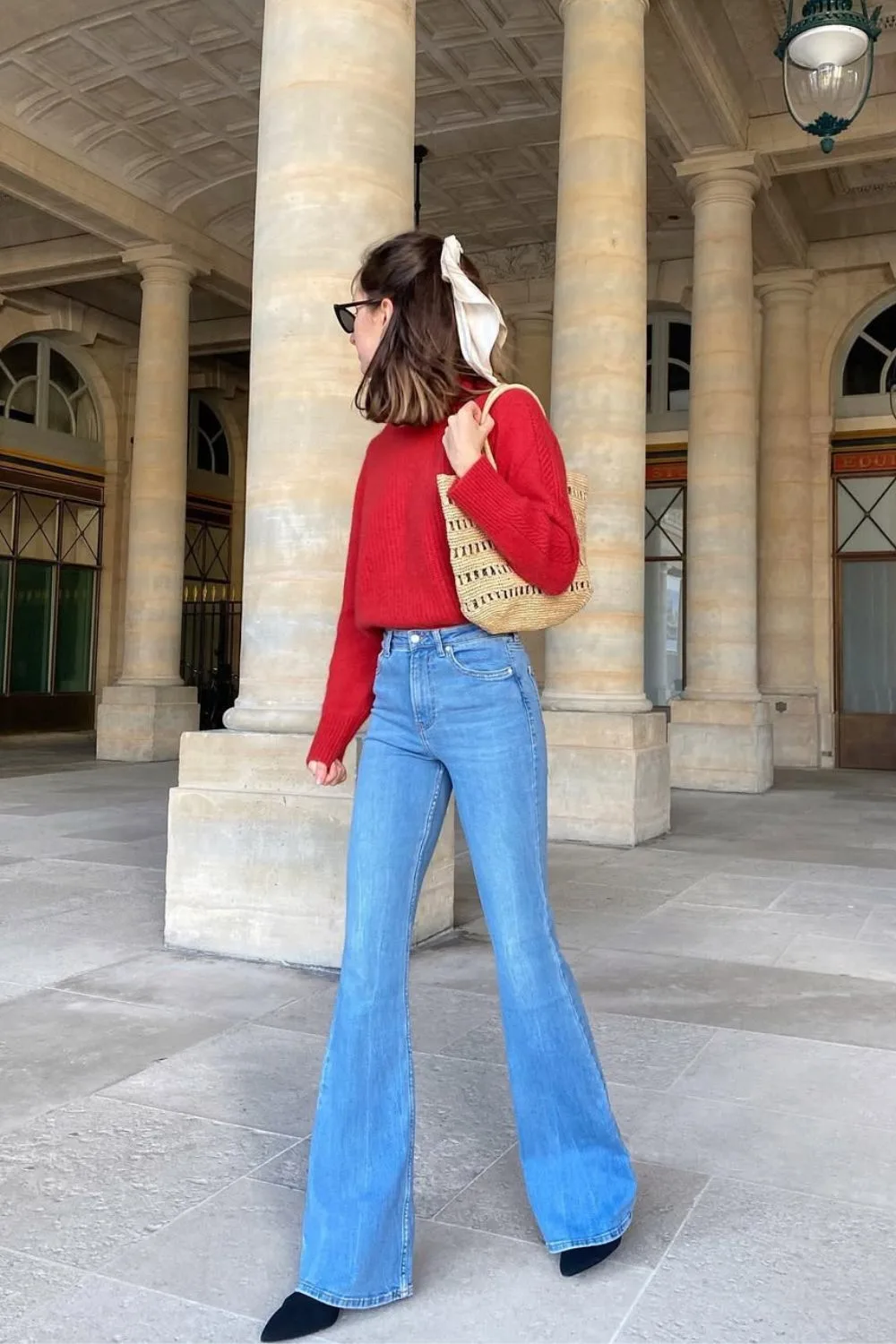 Flare jeans and red sweater