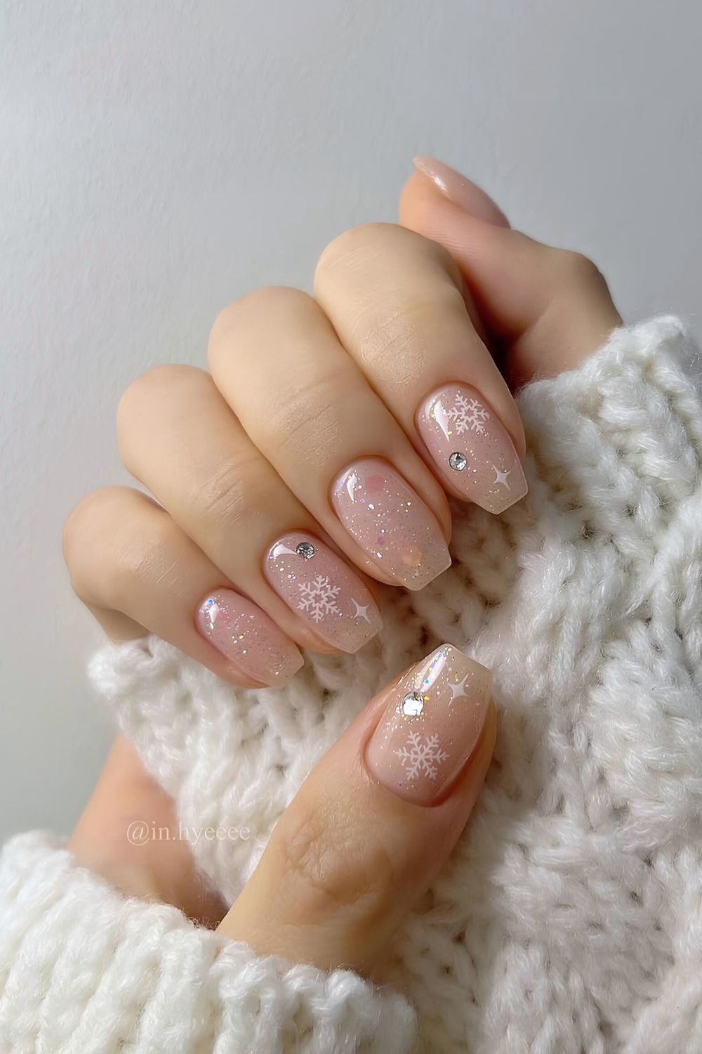 Frosty nails with snowflakes and gems