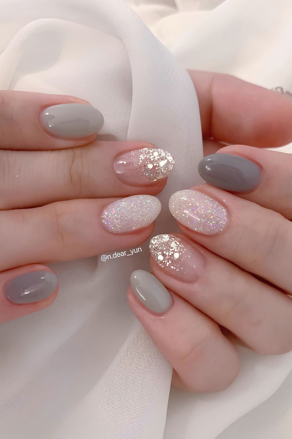 Gray mani with glitter accent nails