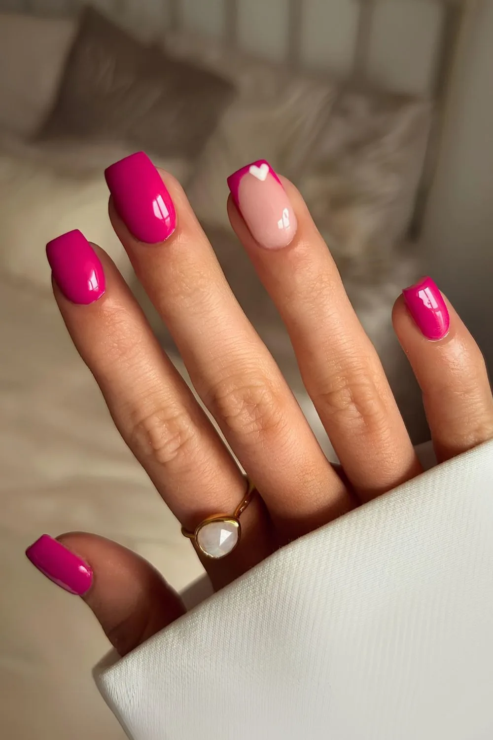 Hot pink nails with tiny heart