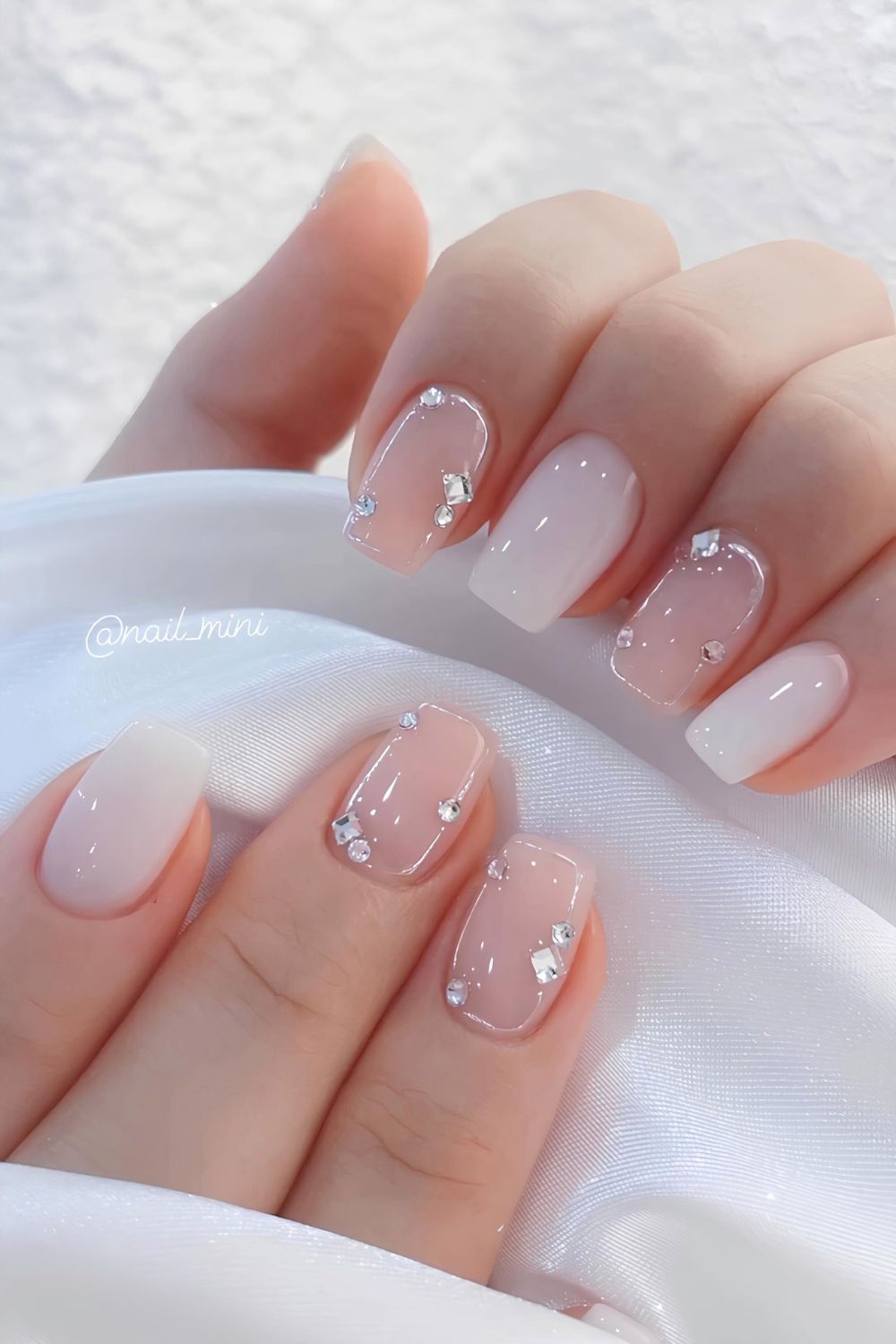 Jelly white nails with rhinestones