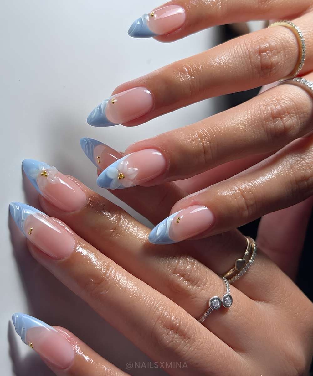 Light blue French mani with sculpted flowers