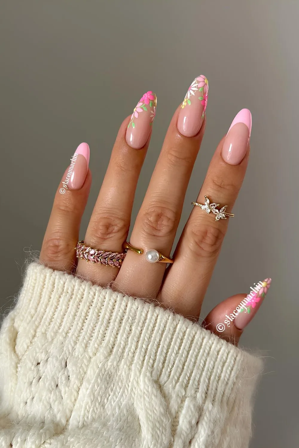 Light pink French nails with floral accents