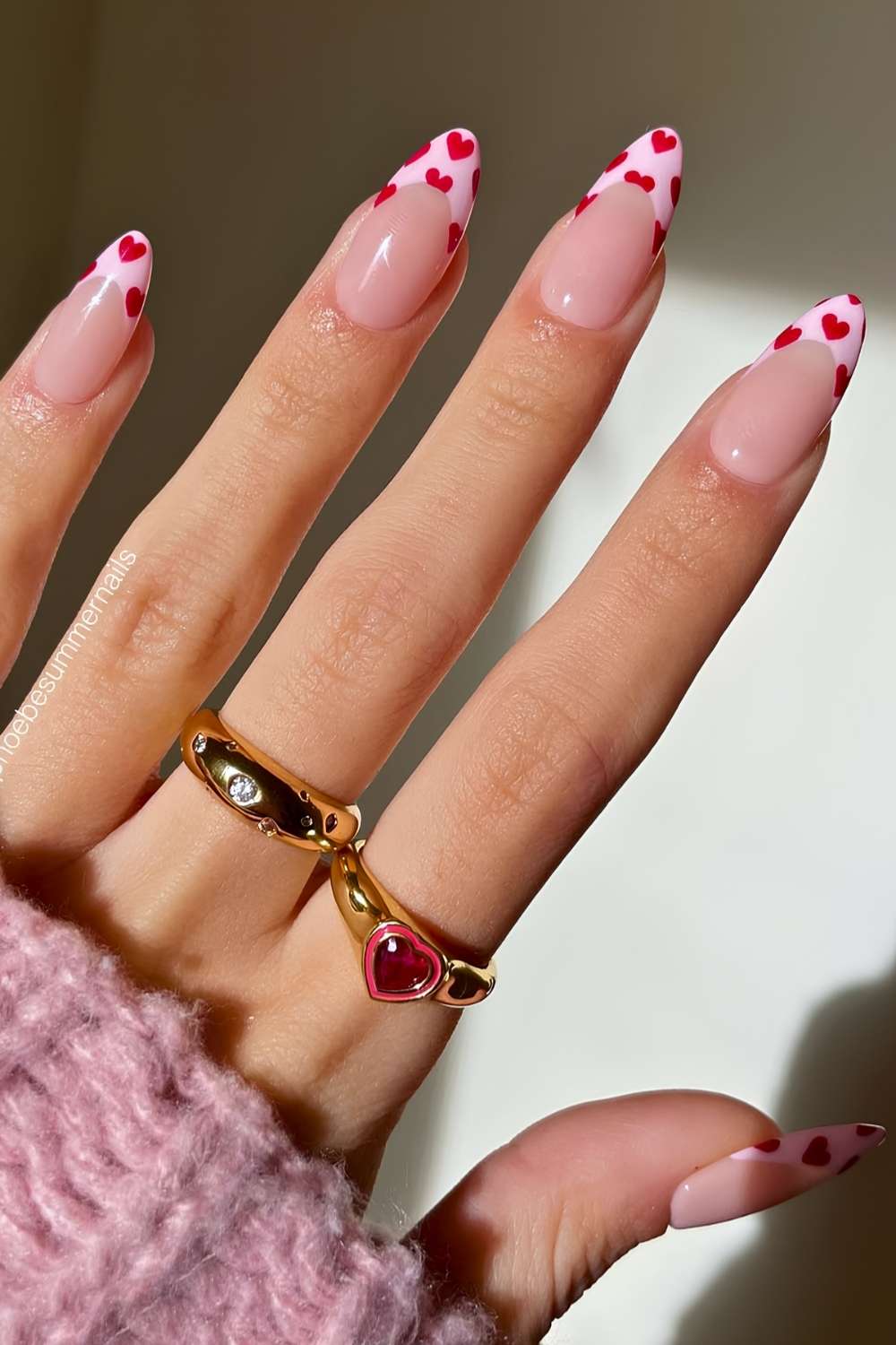 Light pink French tips with red hearts