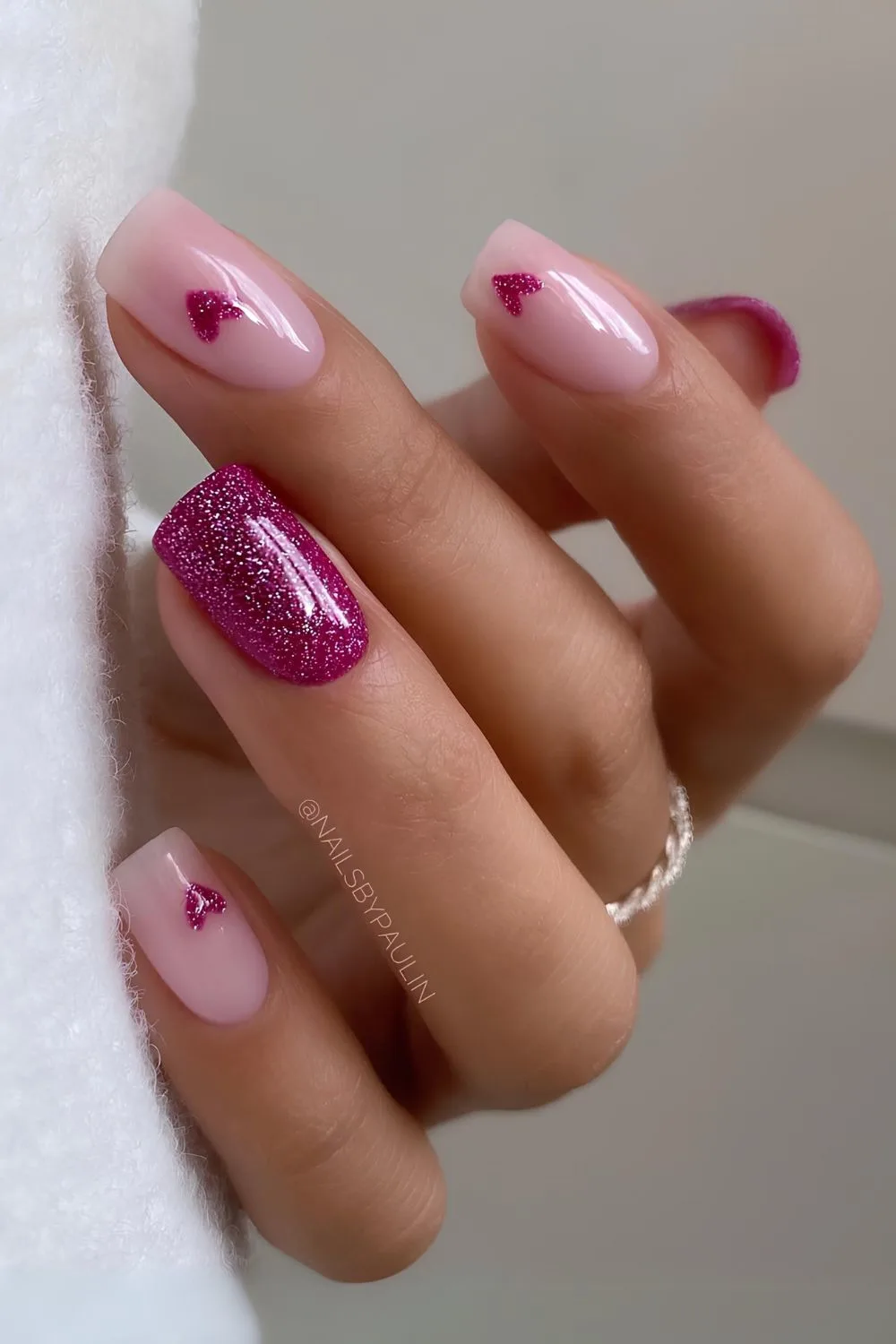 Magenta pink nails with glitter and hearts