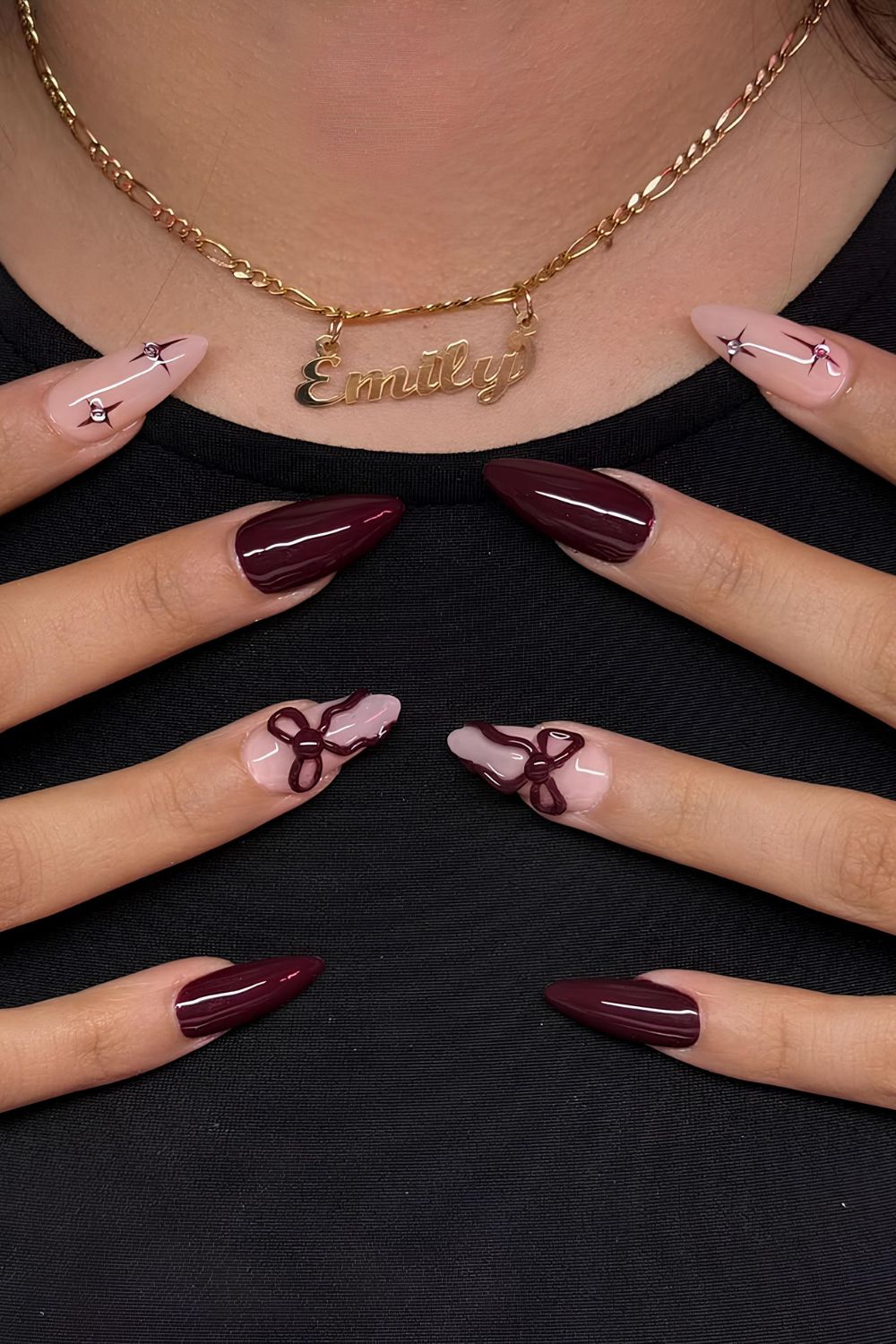 Maroon nails with bows and stars