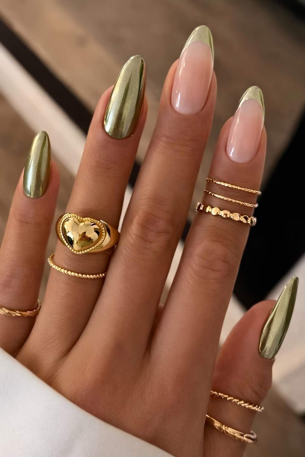 Metallic green nails with accent French tips