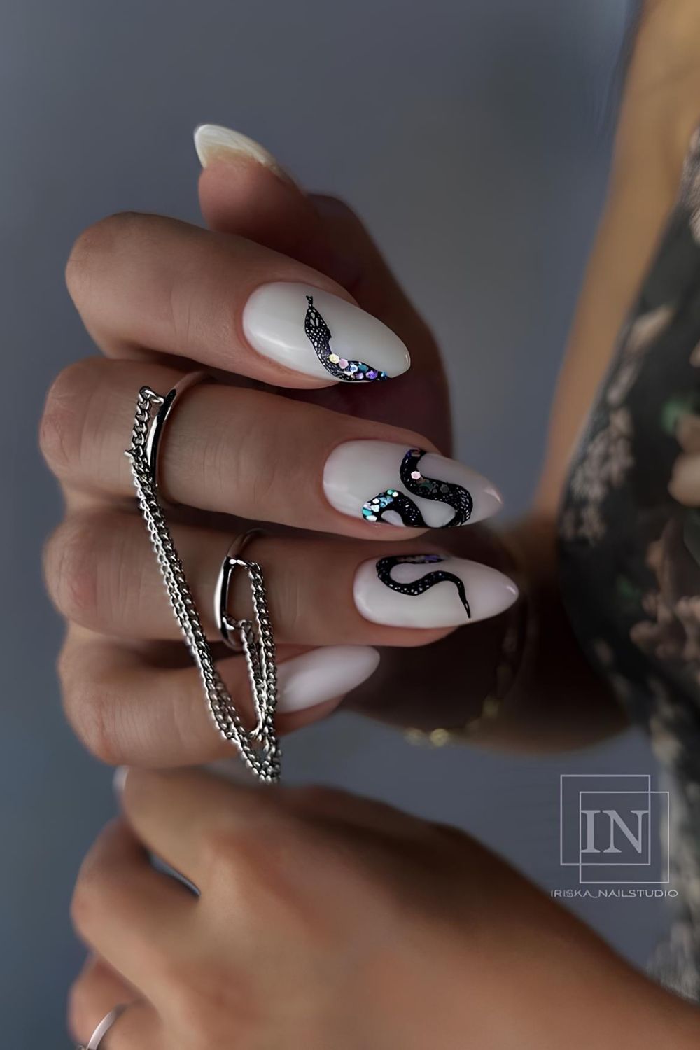 Milky white nails sparkly snake design