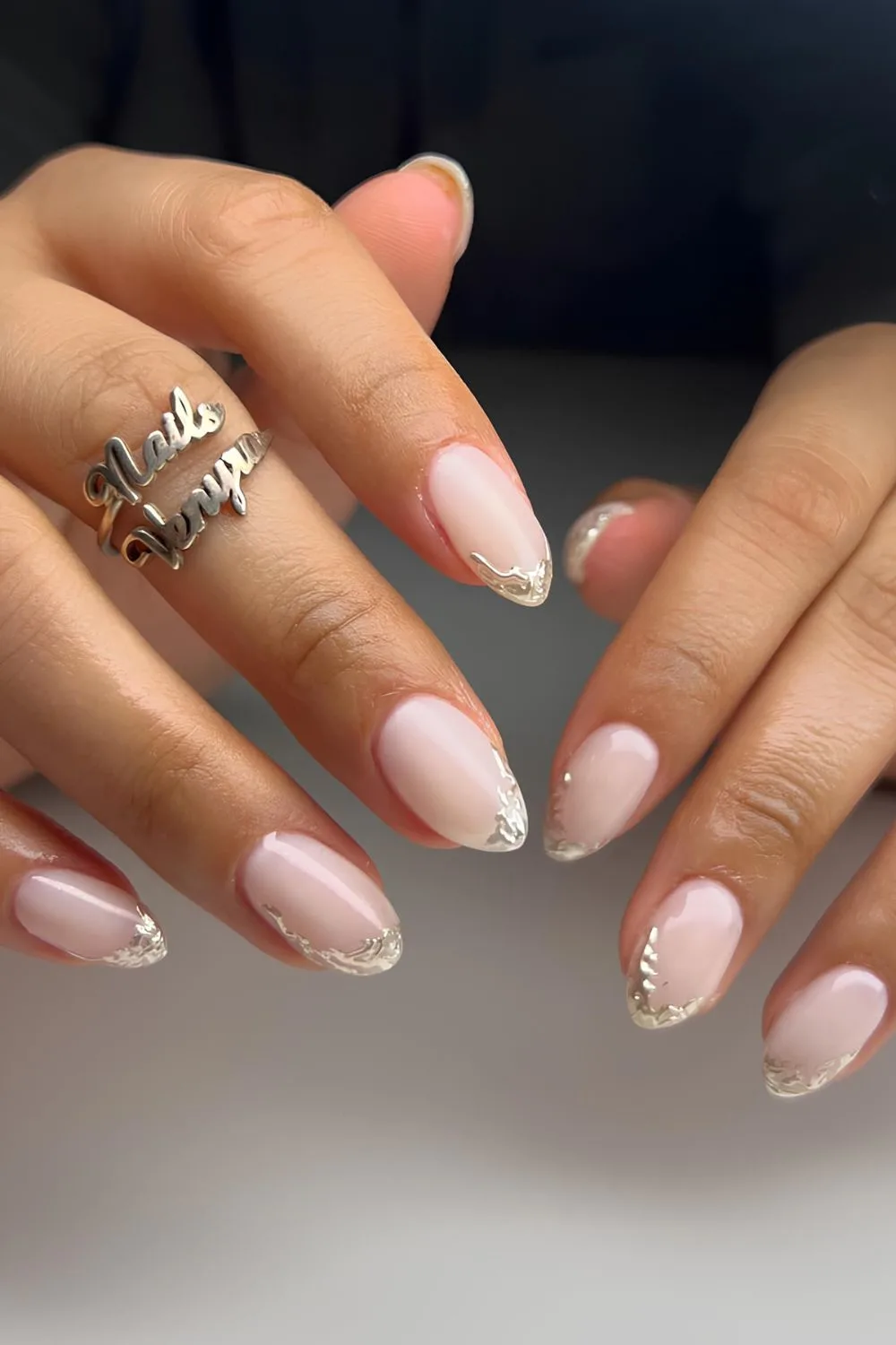 Milky white nails with silver chrome tips