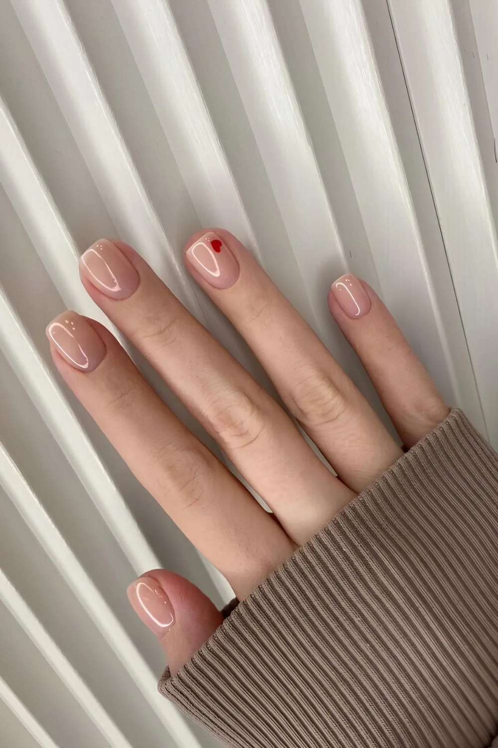 Minimalist Valentines day nails with red heart detail