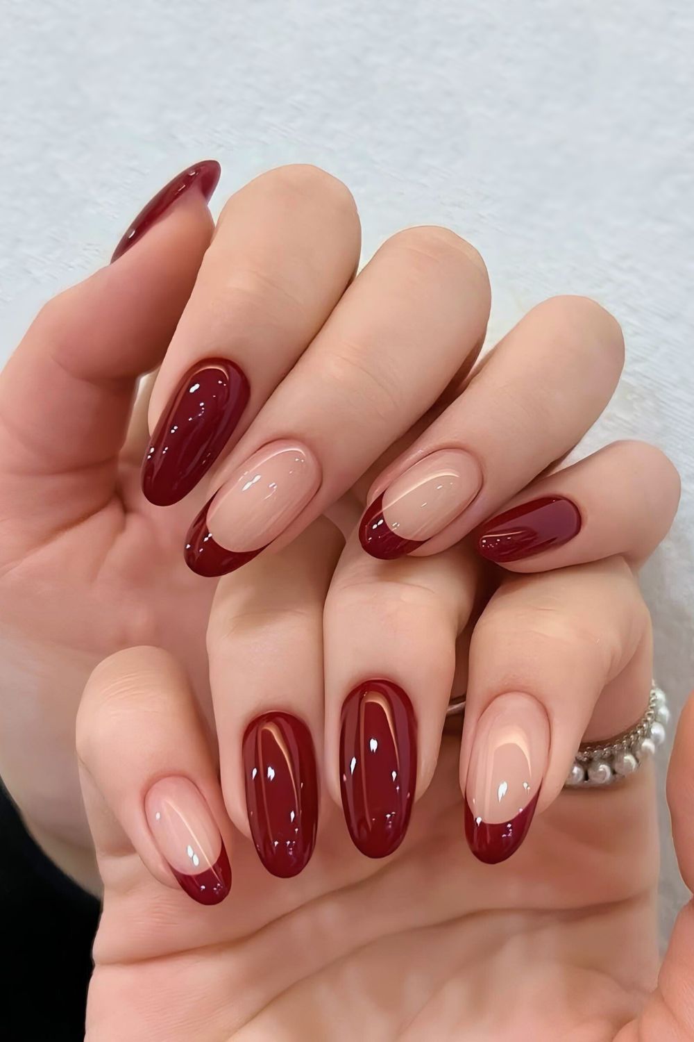 Mix of solid and French tip maroon nails