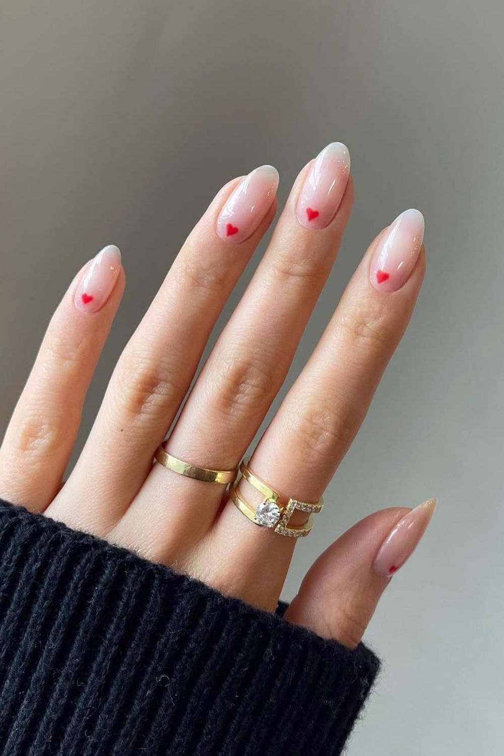 Natural nails with red heart accents