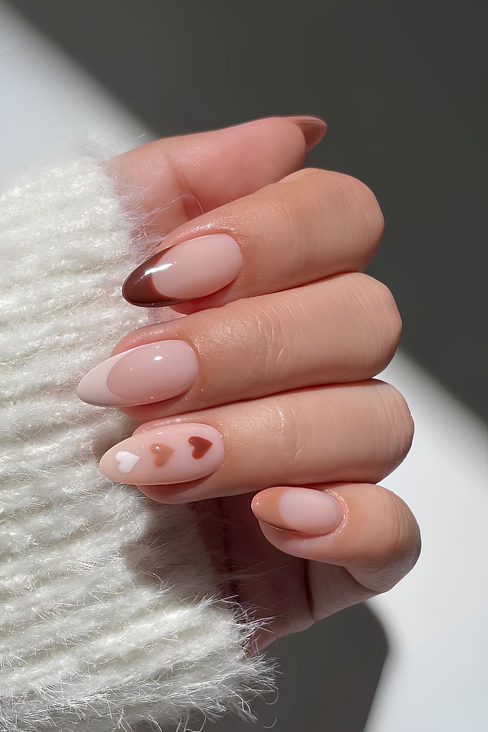 Neutral French Valentine nails with hearts