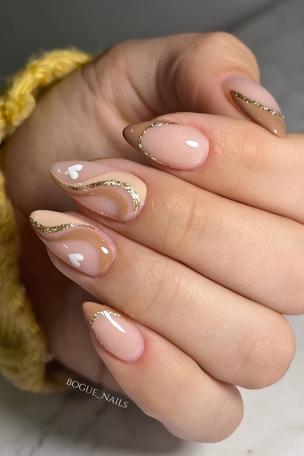 Neutral French mani with swirls and hearts
