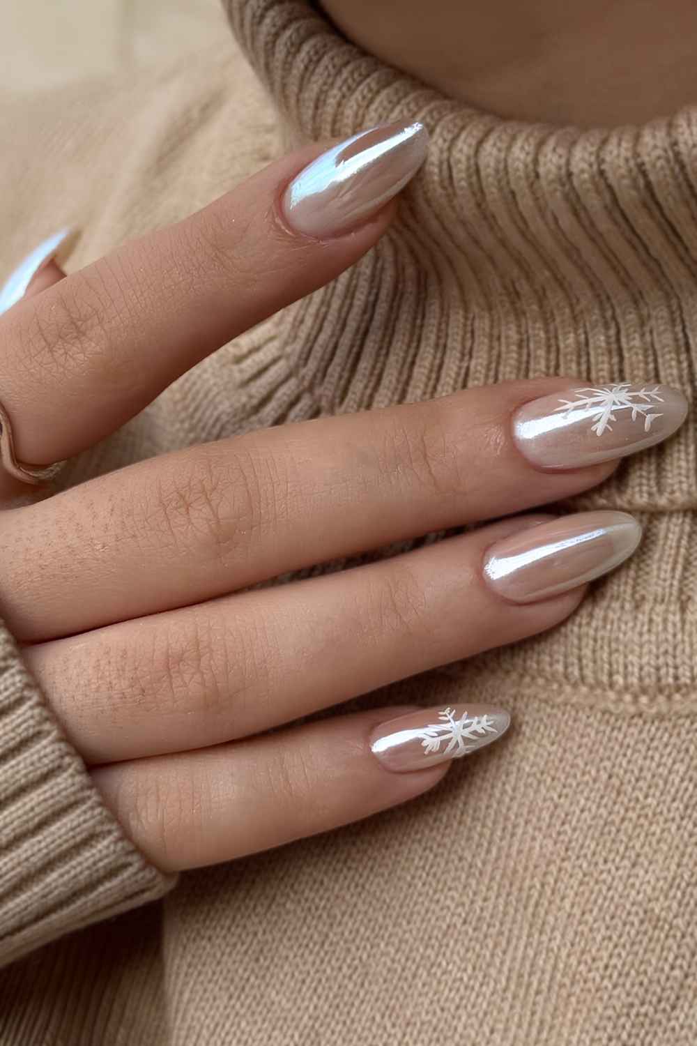 Neutral chrome nails with snowflake art