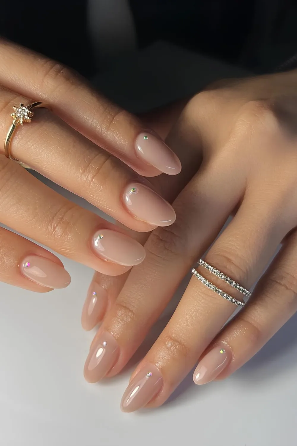 Neutral nails with rhinestone detail on each nail