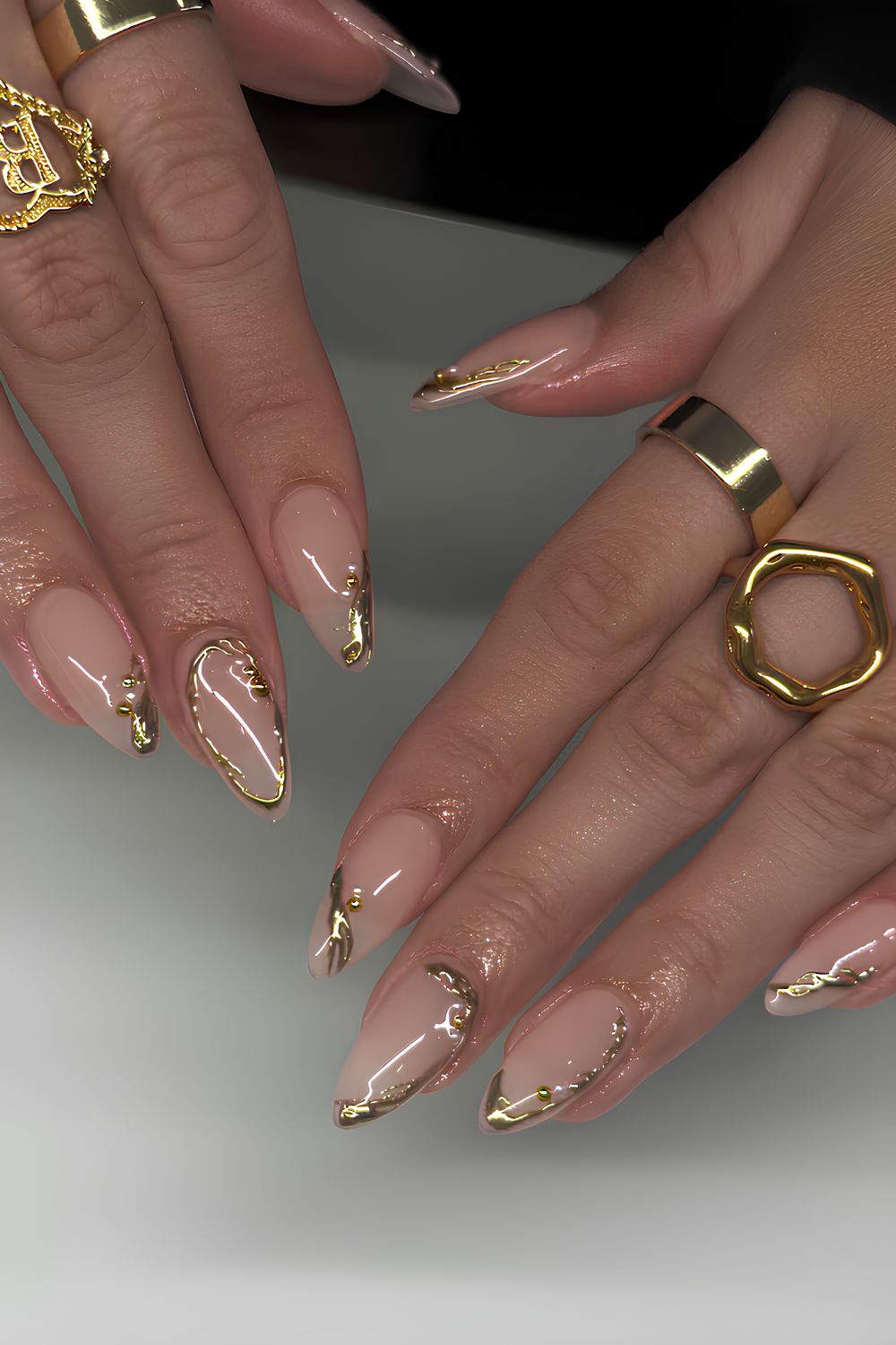 Nude nails with gold chrome accent