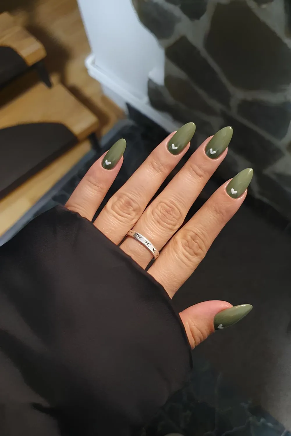 Olive green nails with white heart accents