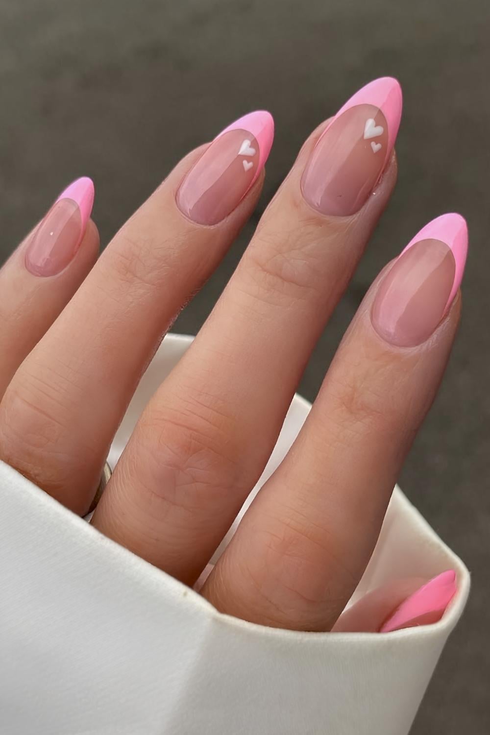 Pink French manicure with white hearts
