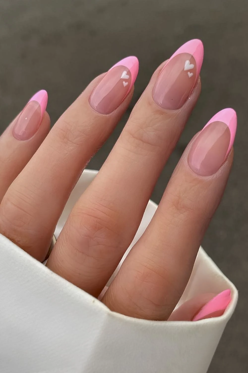 Pink French manicure with white hearts