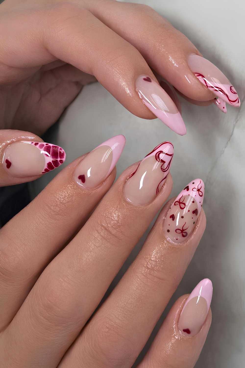 Pink French nails with burgundy Valentines doodles