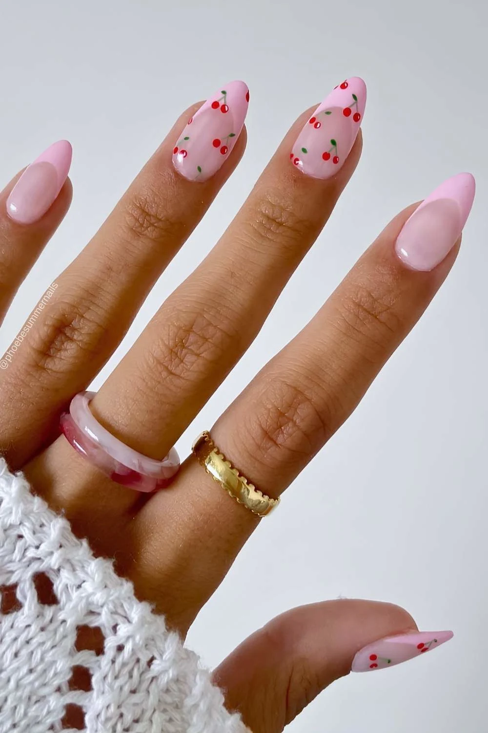 Pink French nails with micro cherry art