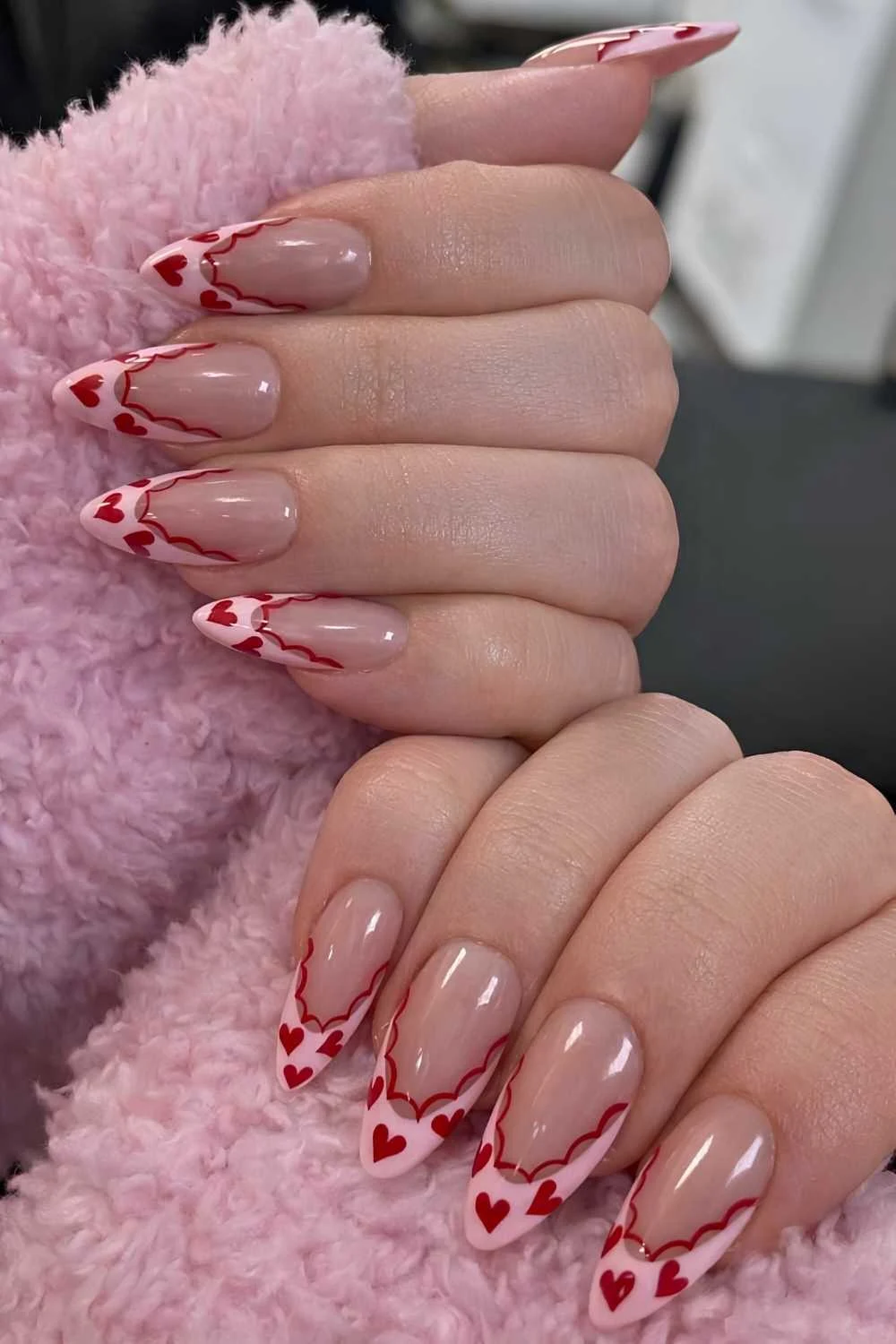 Pink French nails with red hearts and lace art