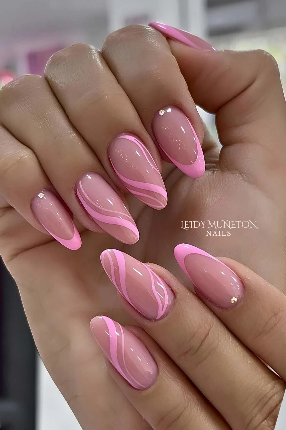 Pink French nails with swirls and gems