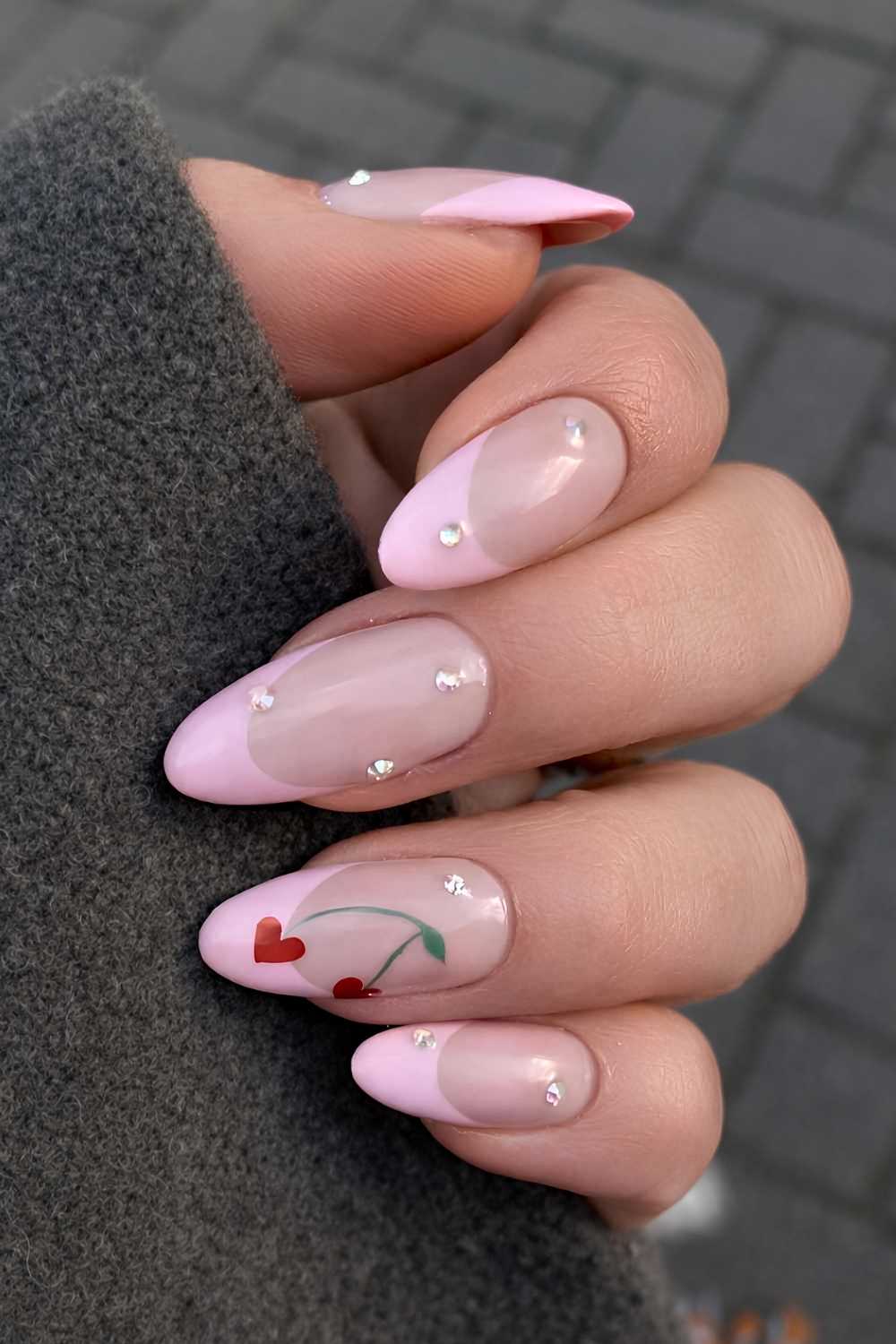 Pink French tips with red heart shaped cherry art