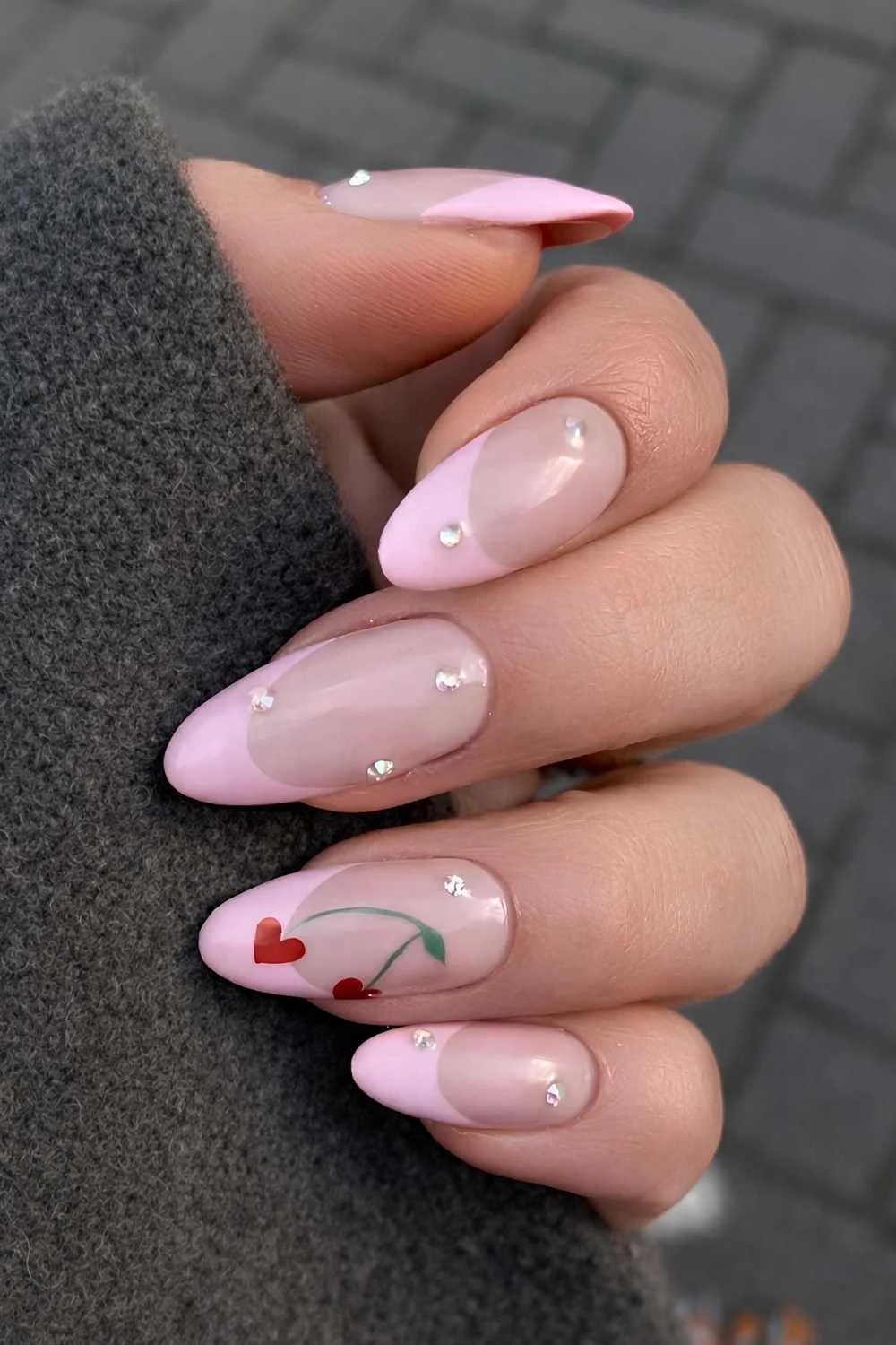 Pink French tips with red heart shaped cherry art