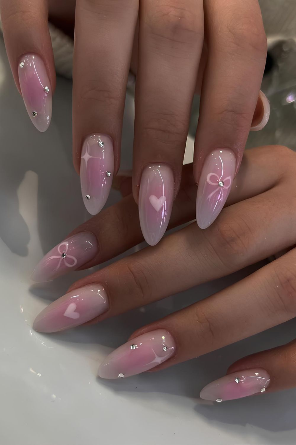 Pink aura mani with tiny bows and hearts