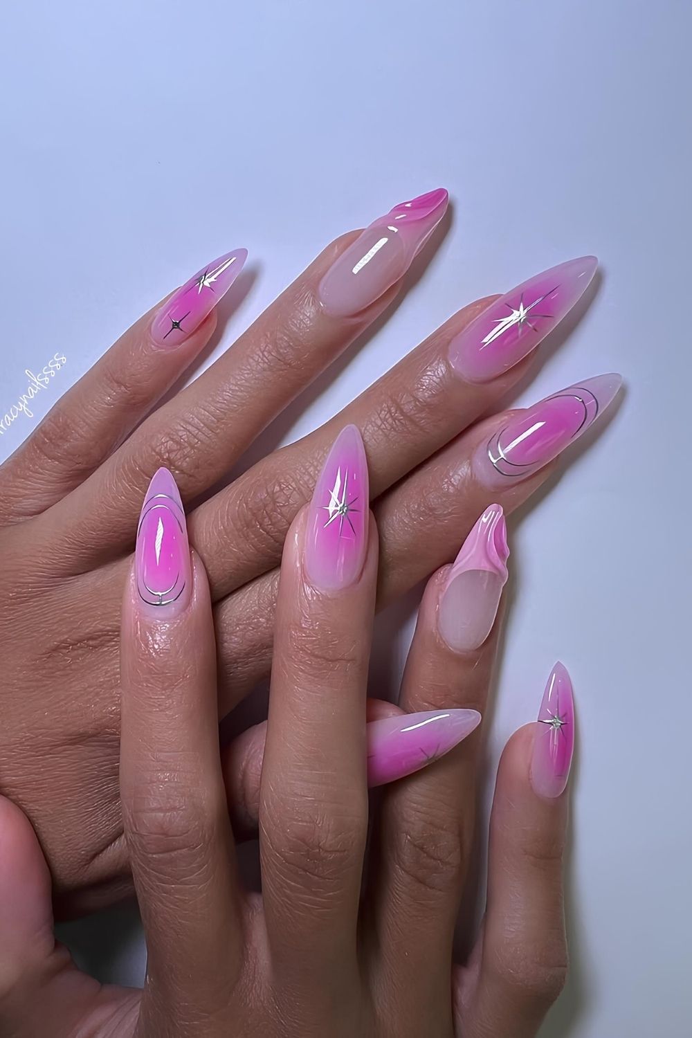 Pink aura nails with chrome accents and 3d design and rhinestones