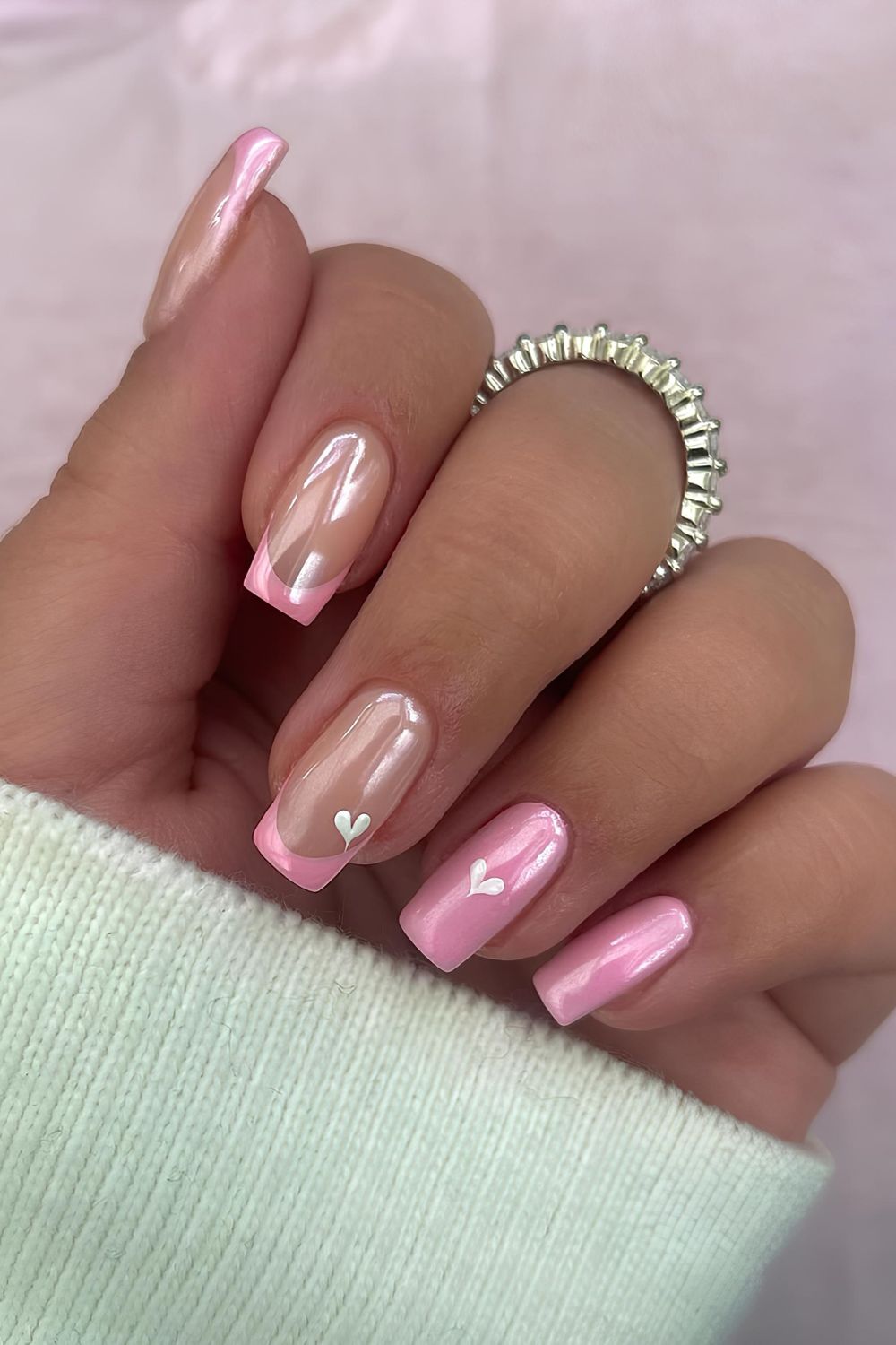 Pink chrome French and solid mix nails with heart accents