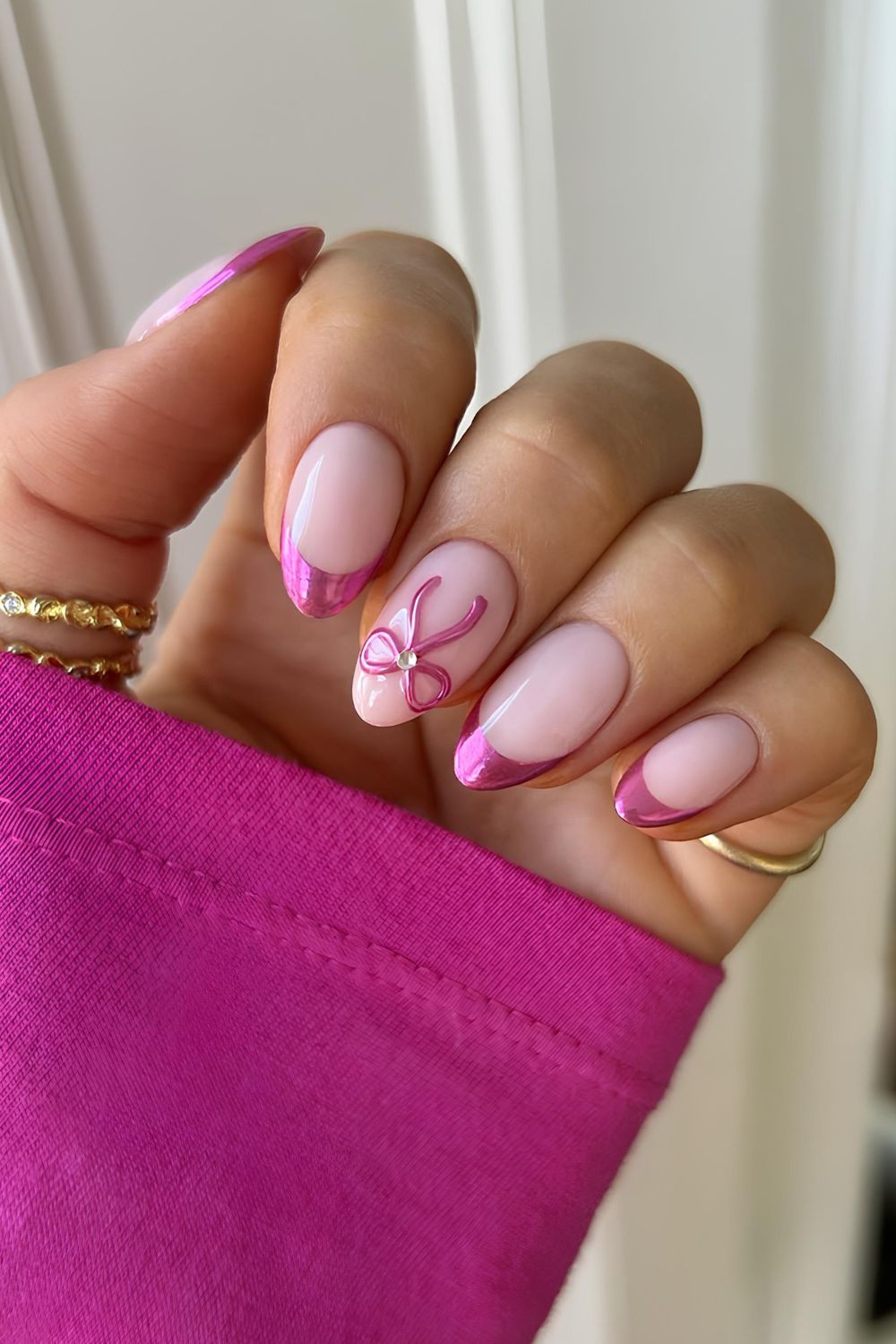 Pink chrome French nails with bows