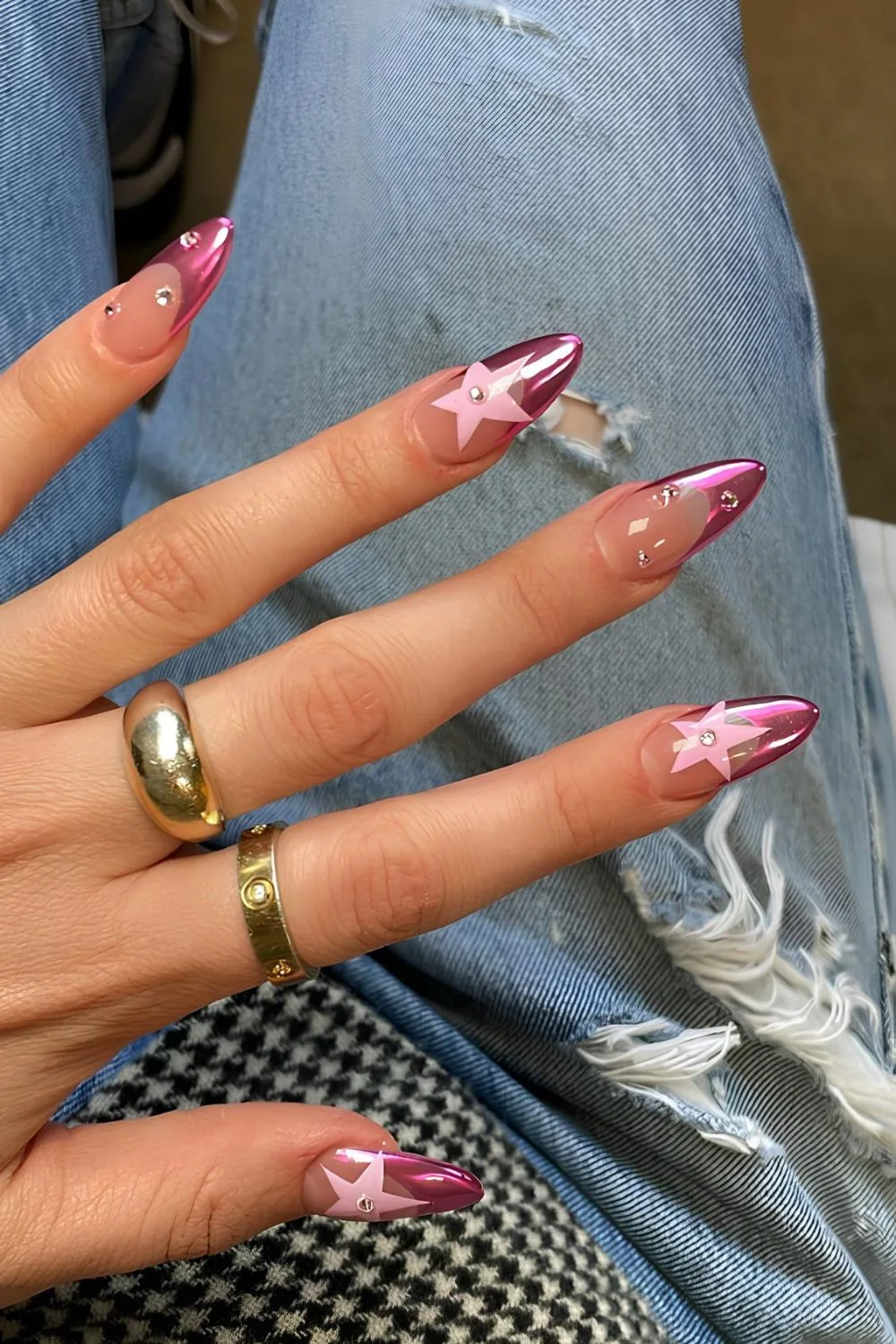 Pink chrome French tip nails with star accents