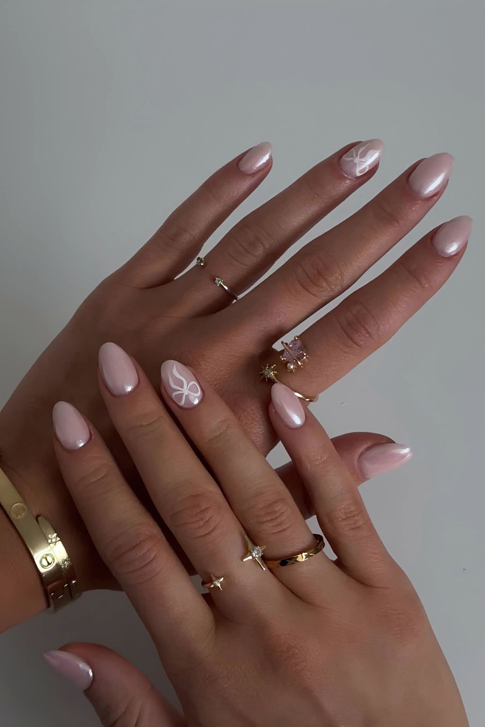 Pink chrome nails with bows