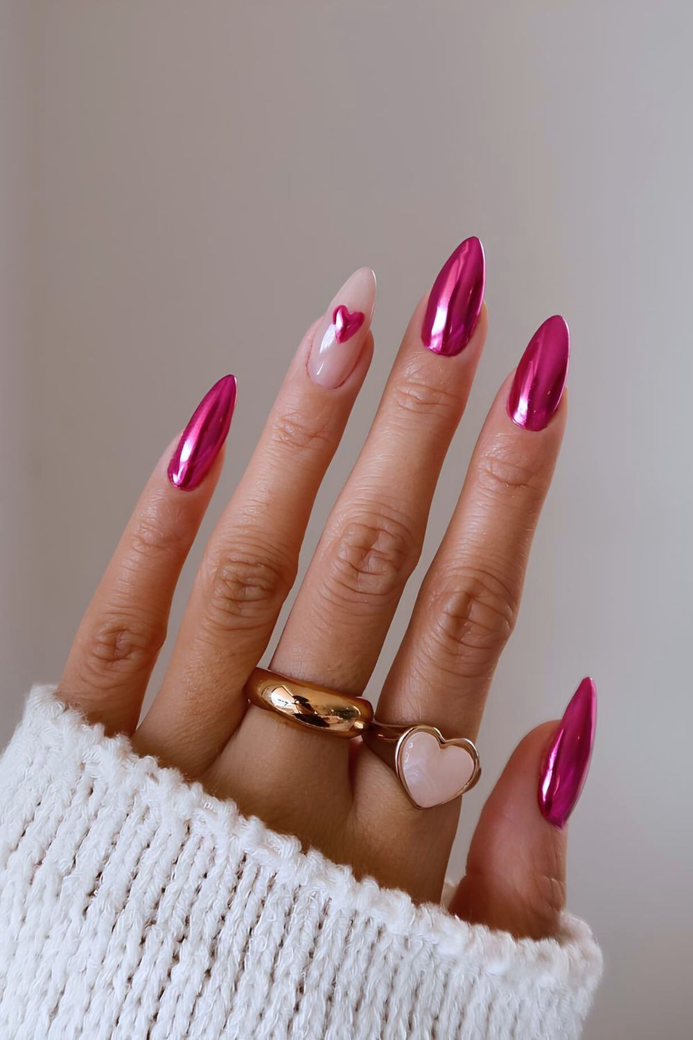 Pink chrome nails with heart accent