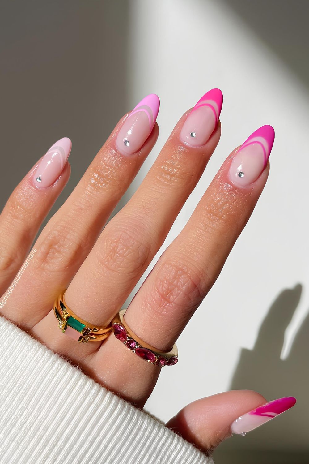 Pink gradinet French tip nails with rhinestone accents