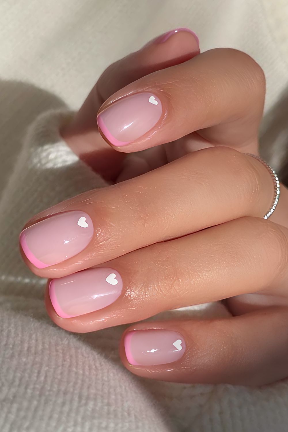 Pink micro French nails with white hearts
