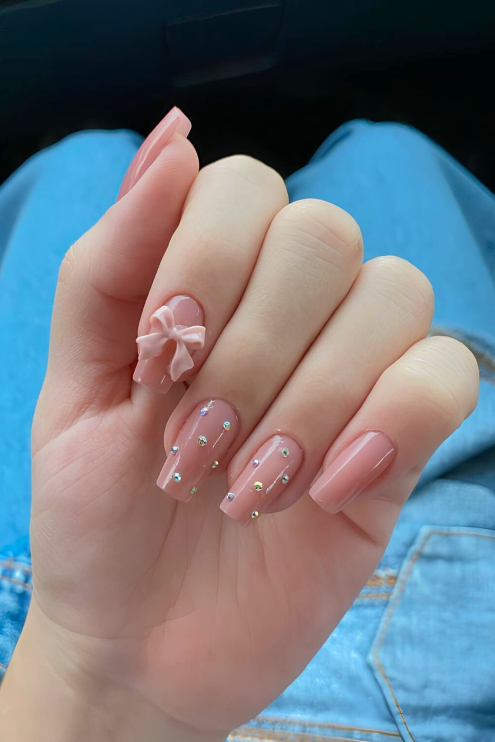 Pink nails with gems and 3D bow