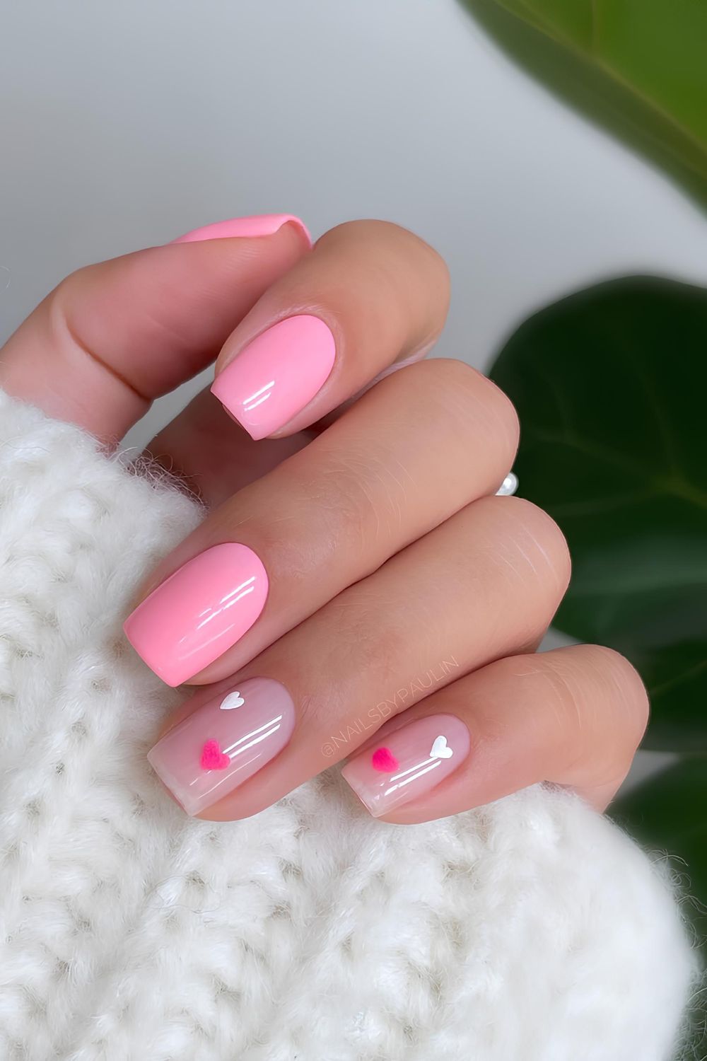 Pink nails with heart accents