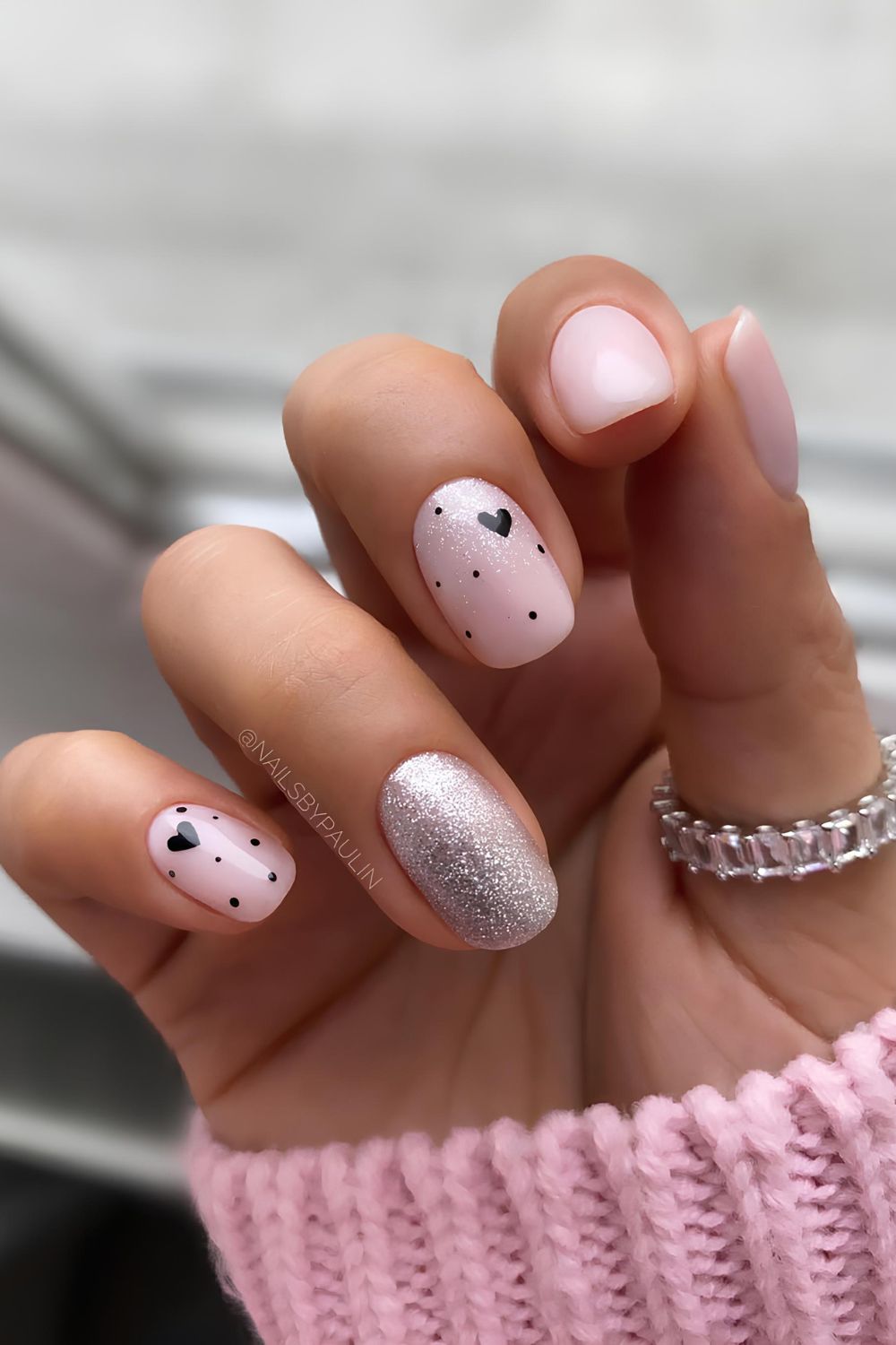 Pink nails with hearts and silver glitter