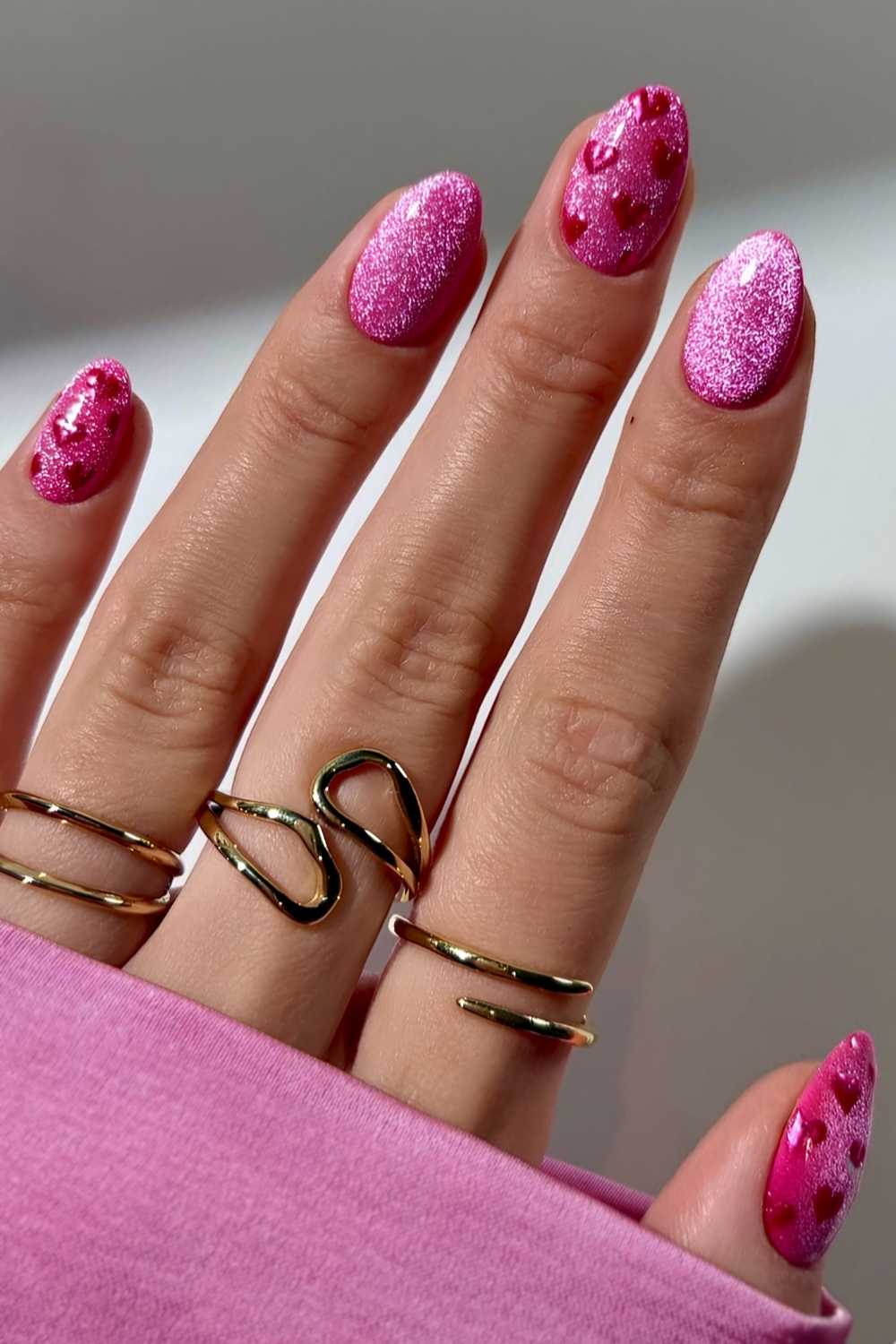 Pink velvet manicure with accent heart