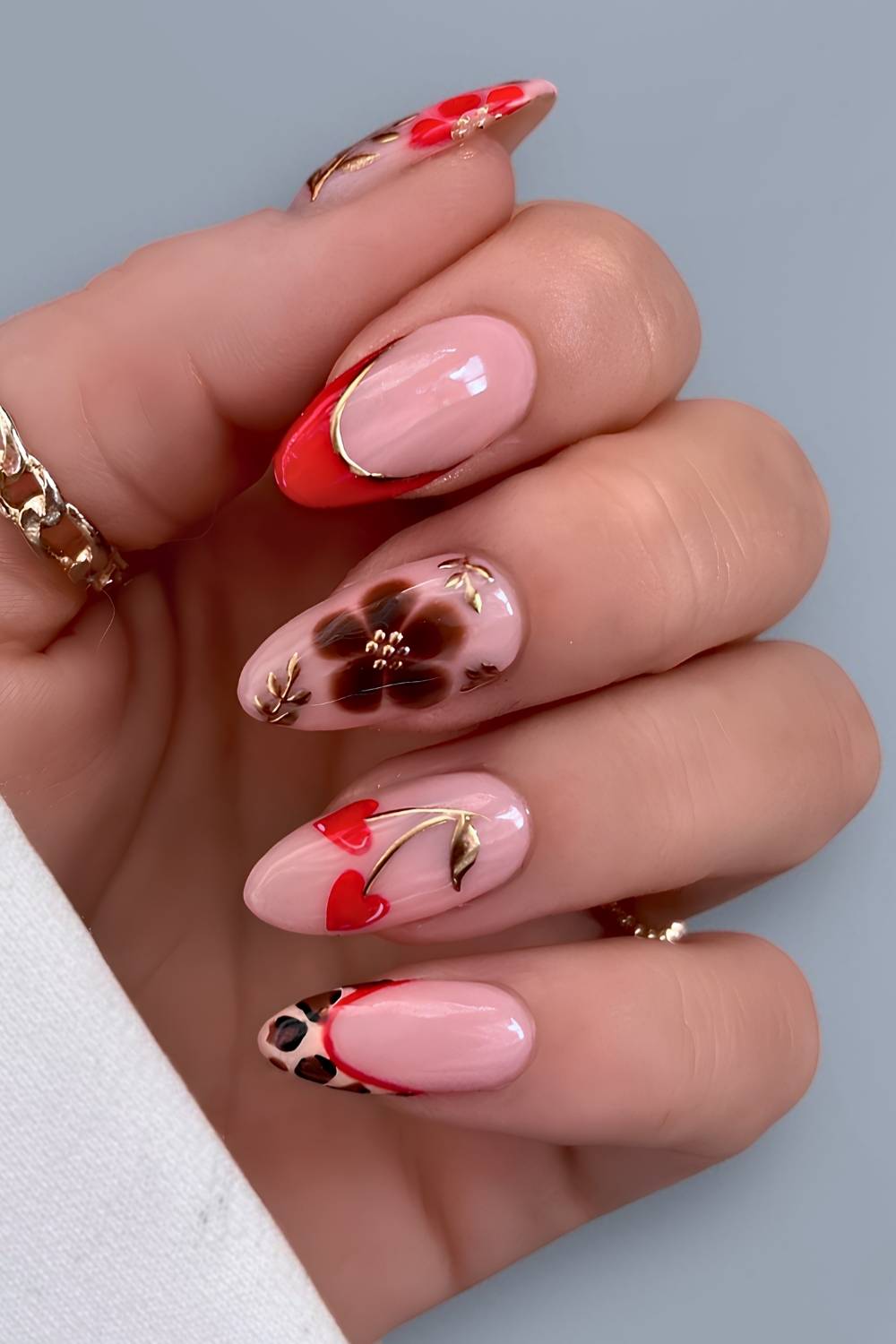 Red French mani with animal print and cherry hearts