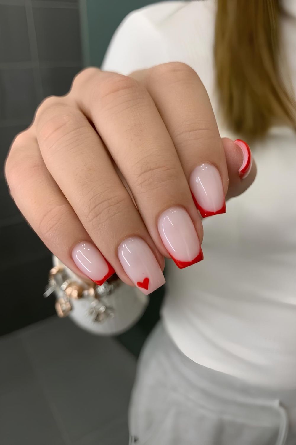 Red French tips with heart detail