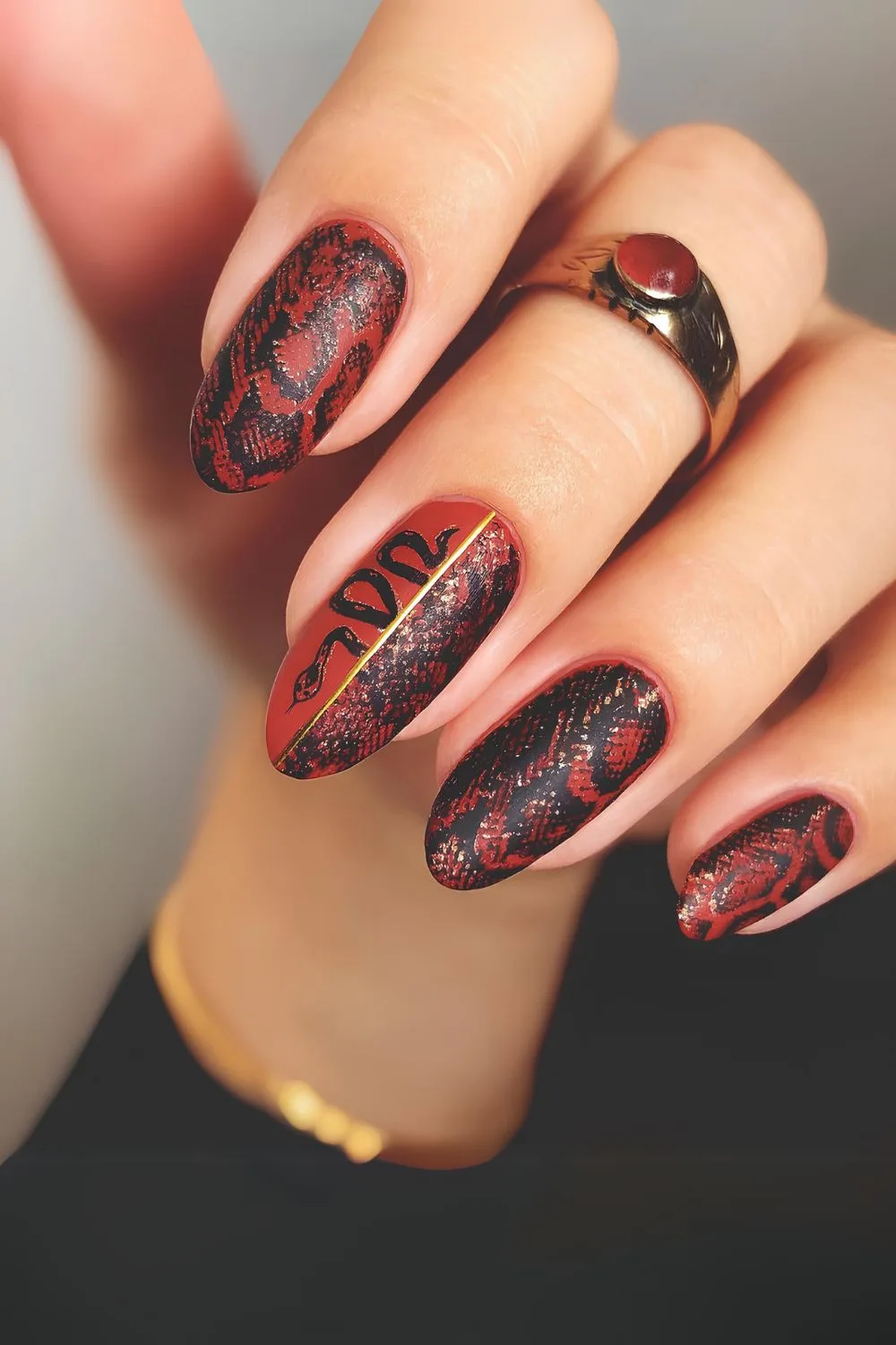 Red and black snake skin print nails