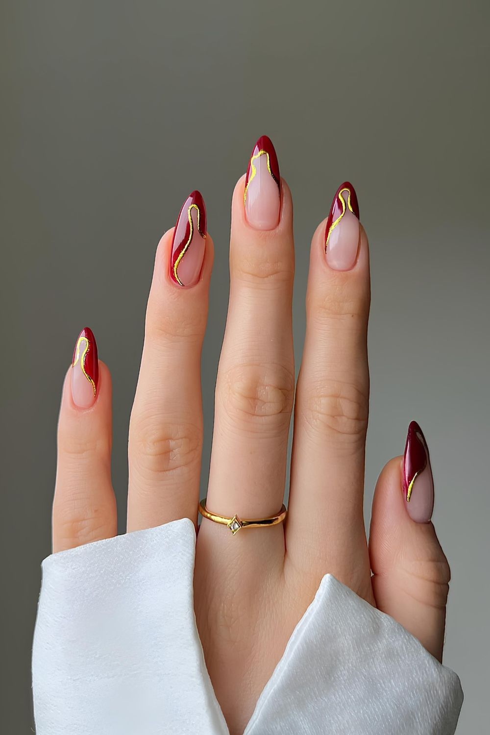 Red and gold abstract French nails