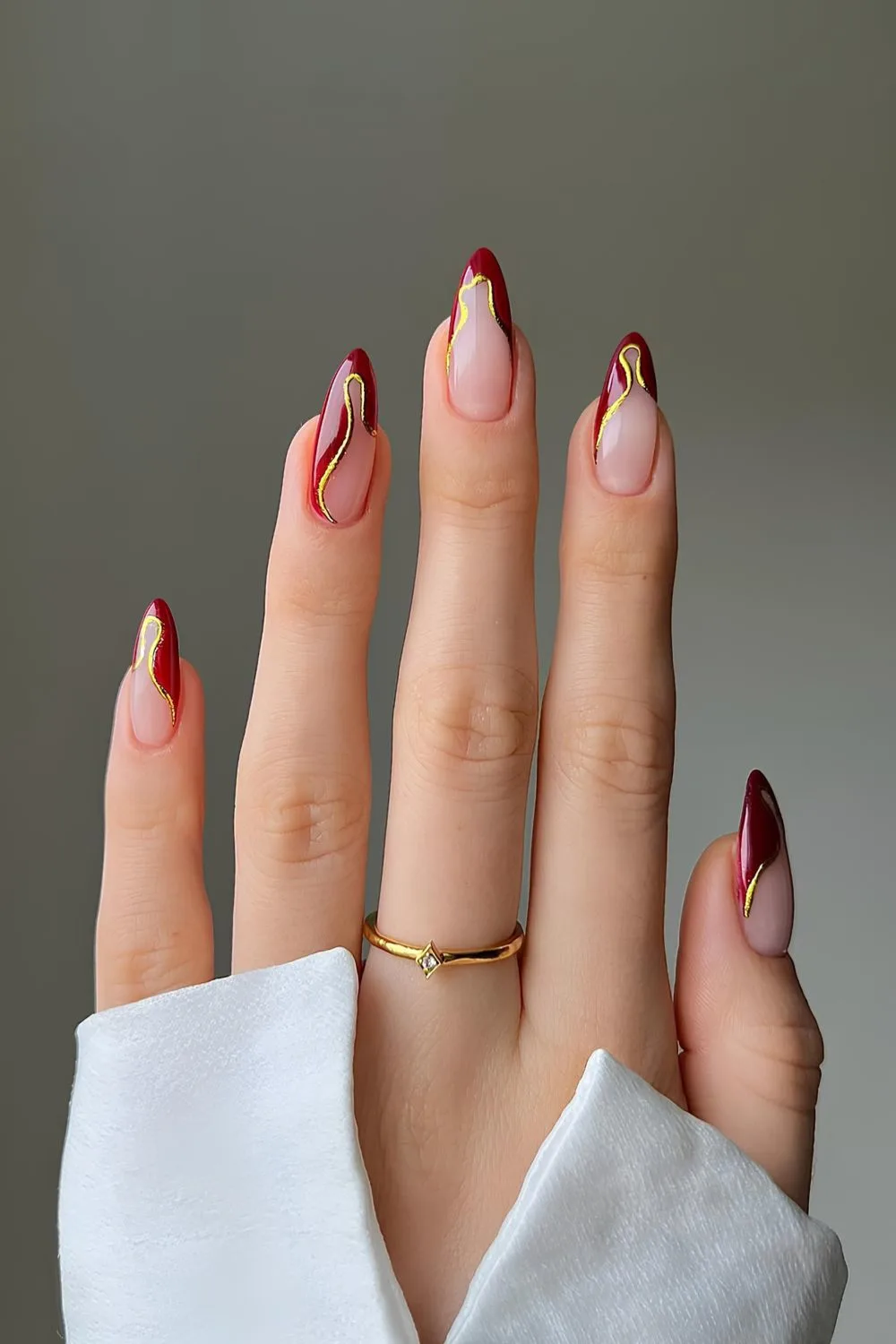 Red and gold abstract French nails