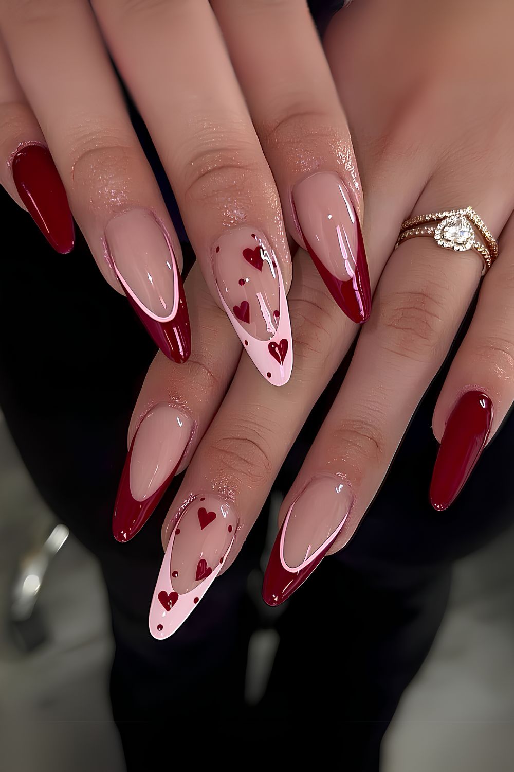 Red and pink French nails with accent hearts